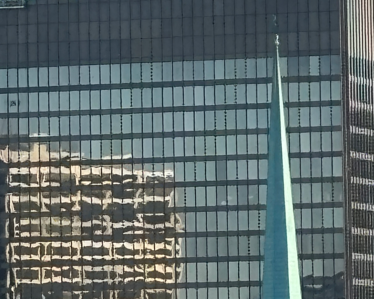 Tall building reflecting other buildings