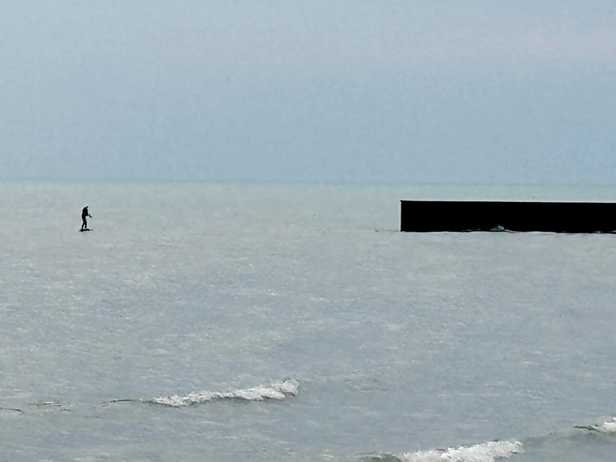 Lone person using a foil board on Lake Michigan